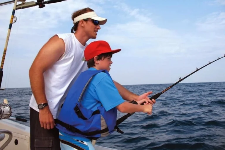 boy fishing in dubai